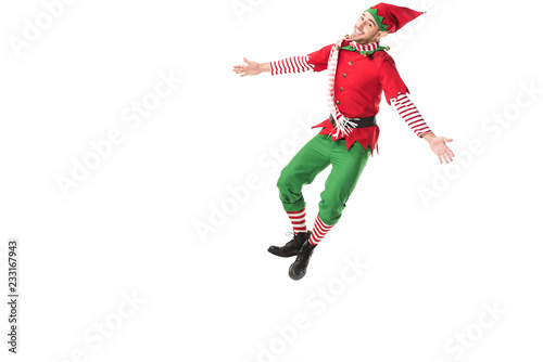 happy man in christmas elf costume jumping isolated on white background