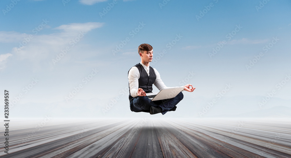 Businessman in lotus pose. Mixed media Businessman in lotus pose. Mixed media