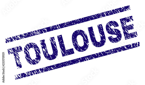 TOULOUSE seal print with distress style. Blue vector rubber print of TOULOUSE text with corroded texture. Text caption is placed between parallel lines.
