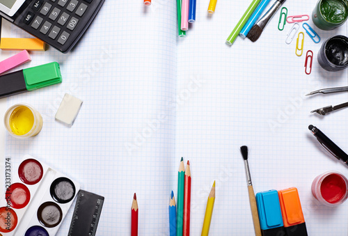 School supplies on exercise book. Back to school concept.