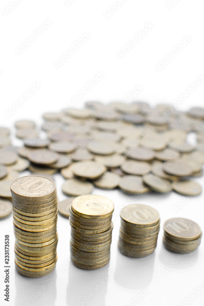 on a white background with a reflection of a lot of scattered coins and a column on a white background with a reflection of a lot of scattered coins and a column