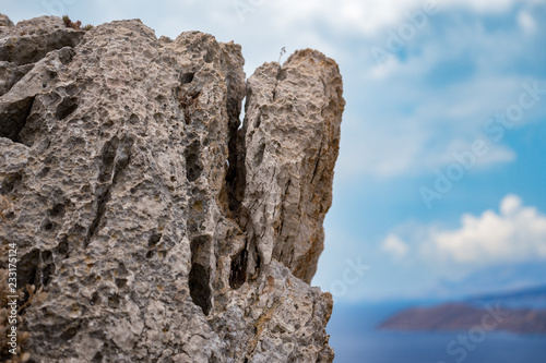 A piece of mountain in Greece against a blue background © Igor