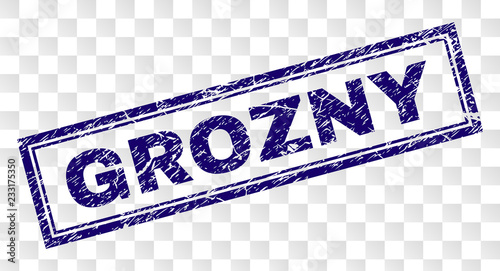 GROZNY stamp seal print with rubber print style and double framed rectangle shape. Stamp is placed on a transparent background. Blue vector rubber print of GROZNY text with scratched texture.