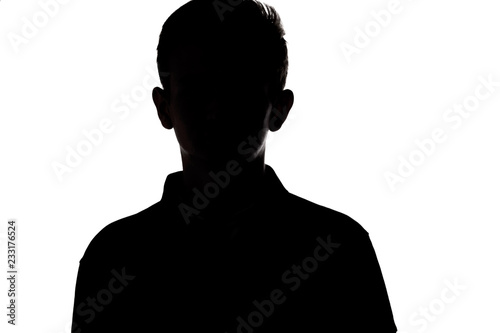 silhouette of an unrecognizable young man, teenager on a white isolated background