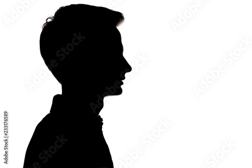 silhouette of young man face profile on a white isolated background