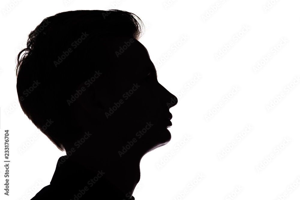 silhouette of an unrecognizable guy, man face profile on a white isolated background
