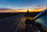aitomobile on the road summer sunset colorful perspective view