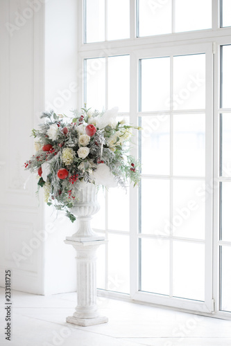 Winter flower arrangement in a bright interior. © ksi