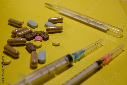 pills on yellow background