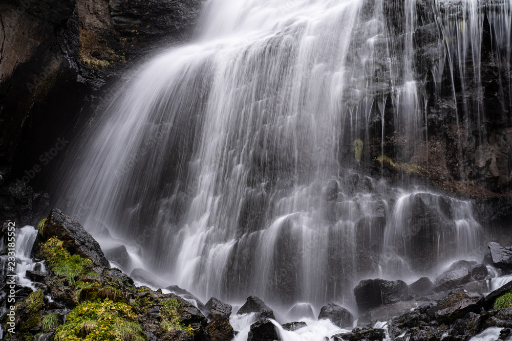 Obraz premium A beautiful landscape with mountain waterfall in Terskol. Elbrus area, Kabardino-Balkaria, Russian Federation