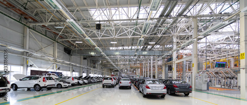 new car is at factory. Warehouse of cars. Modern car Assembly at factory