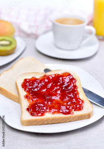 Fresh toast bread or breakfast scene. Healthy fresh fruits and plate with toasts and jam.