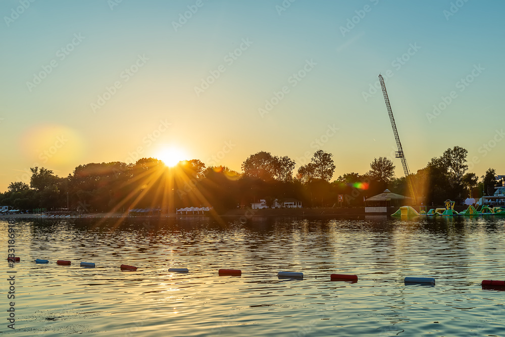 Naklejka premium Belgrade, Serbia - 20 June, 2018: Sunset of beautiful Ada Ciganlija Lake In Belgrade 