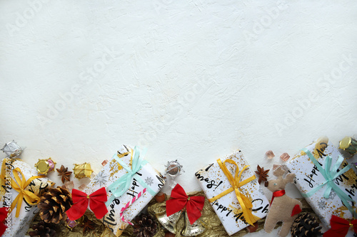 Christmas background with gifts and pine cones. View from above.