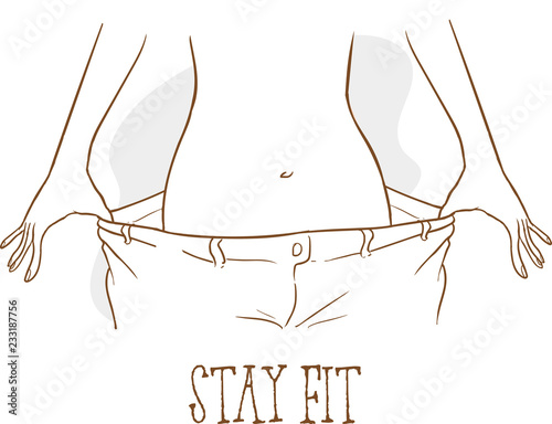 Fit young woman in loose jeans after losing weight isolated on yellow background