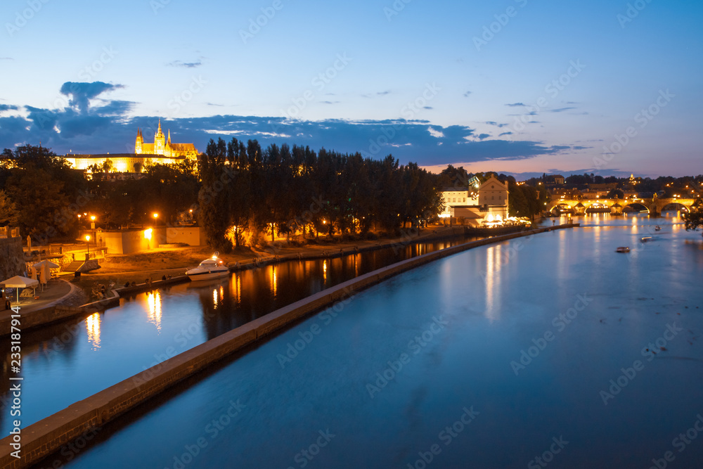 Hradcany evening panorama with Prague Castle, Charles Bridge and Vltava River, Prague, Czech Republic.