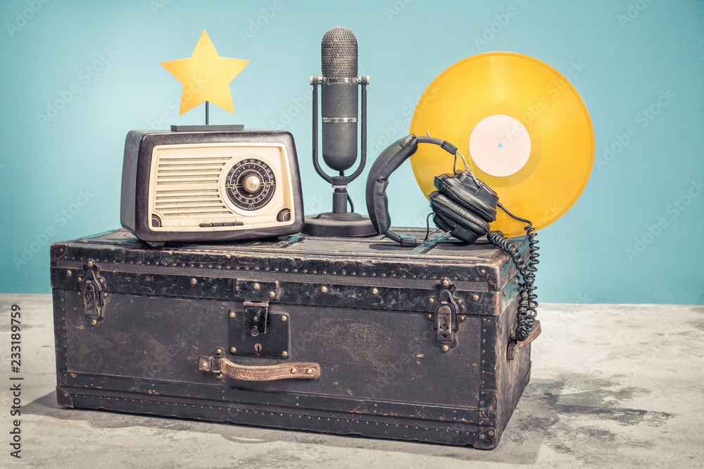 Retro radio from 60s, studio microphone from 50s, and gold colored vinyl  disc record circa 70s,