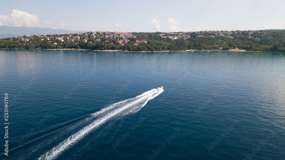 Obraz premium View from the air - powerboat sails to the sea