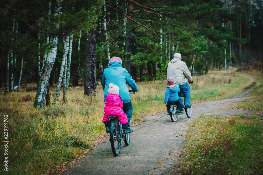 senior grandparents with kids riding bikes in nature senior grandparents with kids riding bikes in nature