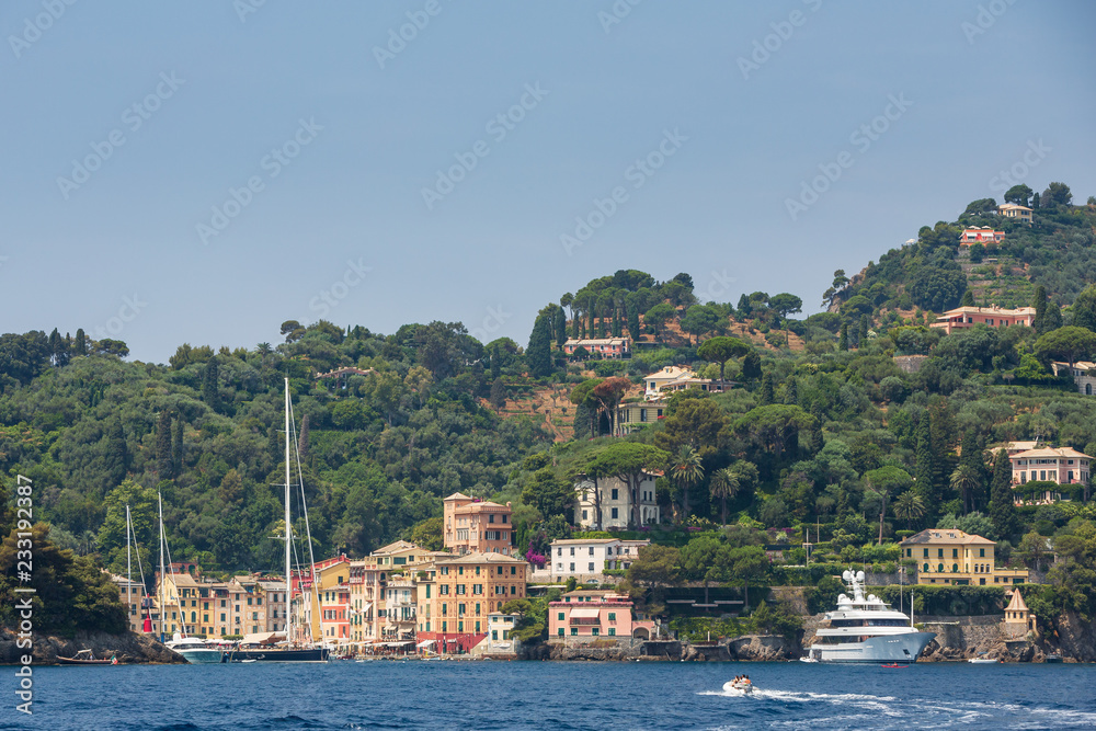 Buildings on the cliffs overlooking the beautiful harbour at Portofino on the  Ligurian coast, Italy