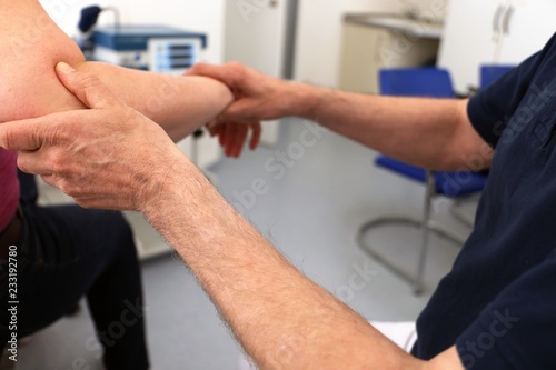 Orthopedist examine an elbow