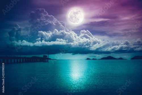 Landscape of sky with full moon on seascape to night. Serenity nature.