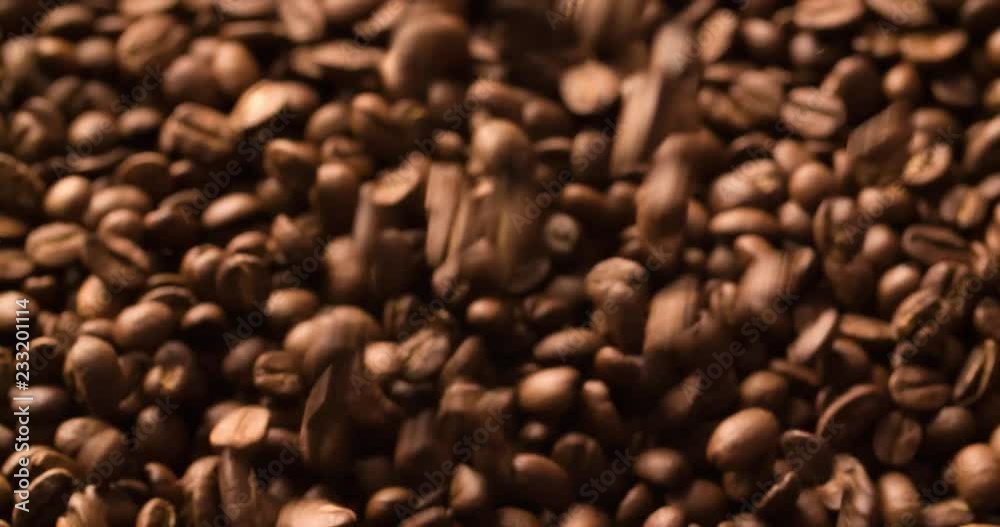Coffee Beans Falling Slow Motion on blurred background close up macro shot Slow motion video Coffee Beans Falling Slow Motion on blurred background close up macro shot Slow motion video