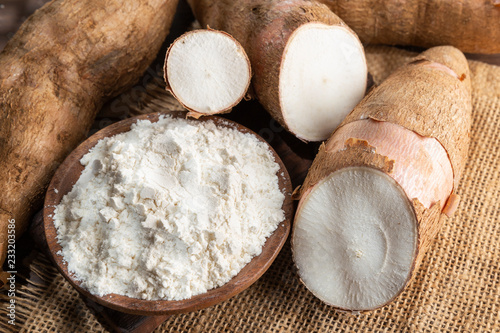 Raw yucca starch on the wooden table - Manihot esculenta.