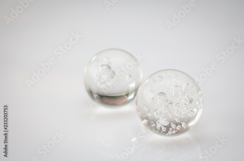 GLASS SPHERE ON A WHITE BACKGROUND