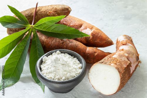 Raw yucca starch on the wooden table - Manihot esculenta.