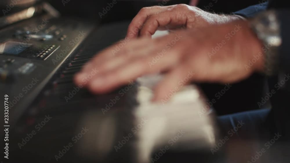 Close up view of hands man pianist playing the fortepiano in a deserted restaurant enjoying the music jazz elegant outfit romantic atmosphere instrument portrait slow motion Close up view of hands man pianist playing the fortepiano in a deserted restaurant enjoying the music jazz elegant outfit romantic atmosphere instrument portrait slow motion
