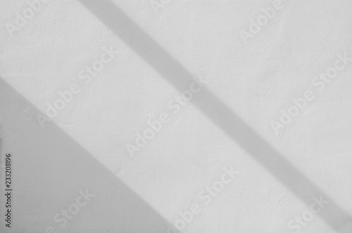 white concrete wall with shadow from window - background