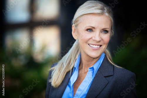 Portrait Of A Mature Businesswoman Smiling At The Camera 
