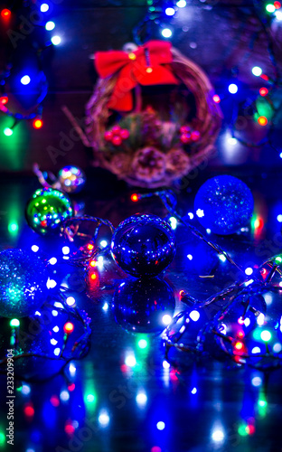 Christmas background, garland lights, holiday toys in blue