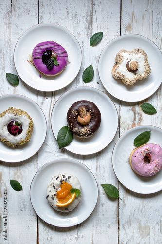 Yummy colorful doughnuts on white board