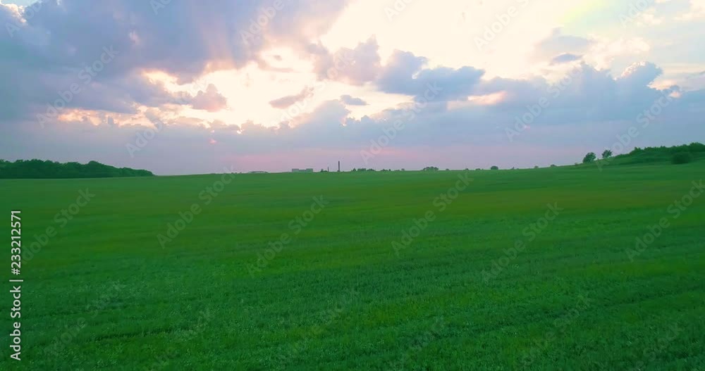 green field at sunset aerial 4k 50p move backward green field at sunset aerial 4k 50p move backward