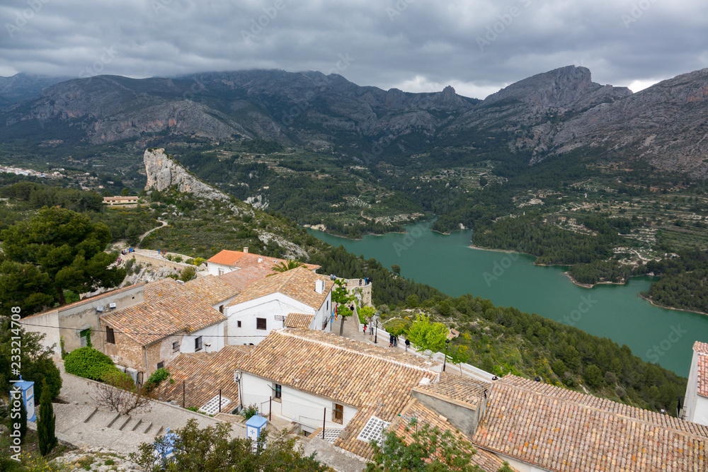 Beautiful view to houses of Guadalest, its lake and moutains
