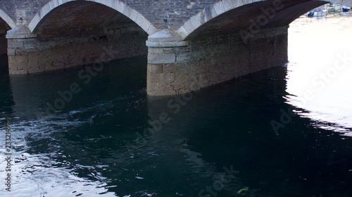 Arches of the bridge with shadow & water