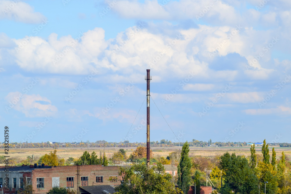Old abandoned buildings of the former factory and warehouses. The destroyed essential oil plant. Soviet heritage. Old brick buildings. Settlement in the Kuban
