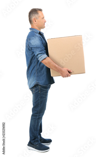 Full length portrait of mature man carrying carton box on white background. Posture concept