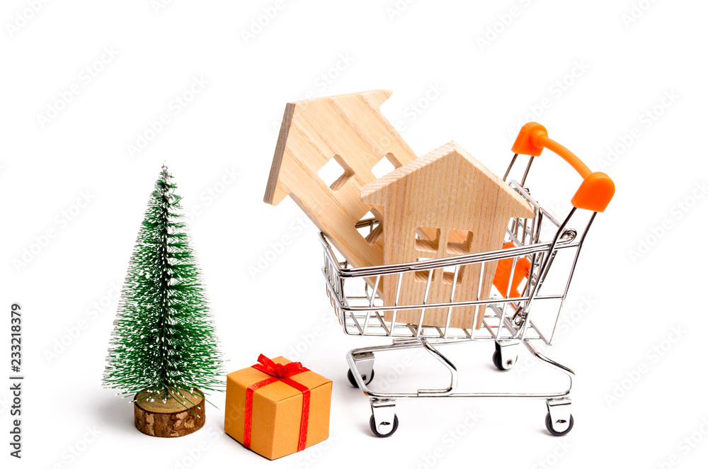 Wooden houses and Christmas tree. Christmas Sale of Real Estate. New Year discounts for buying house. Purchase apartments at a low price. Winter resort and vacation. Holiday discounts. isolated