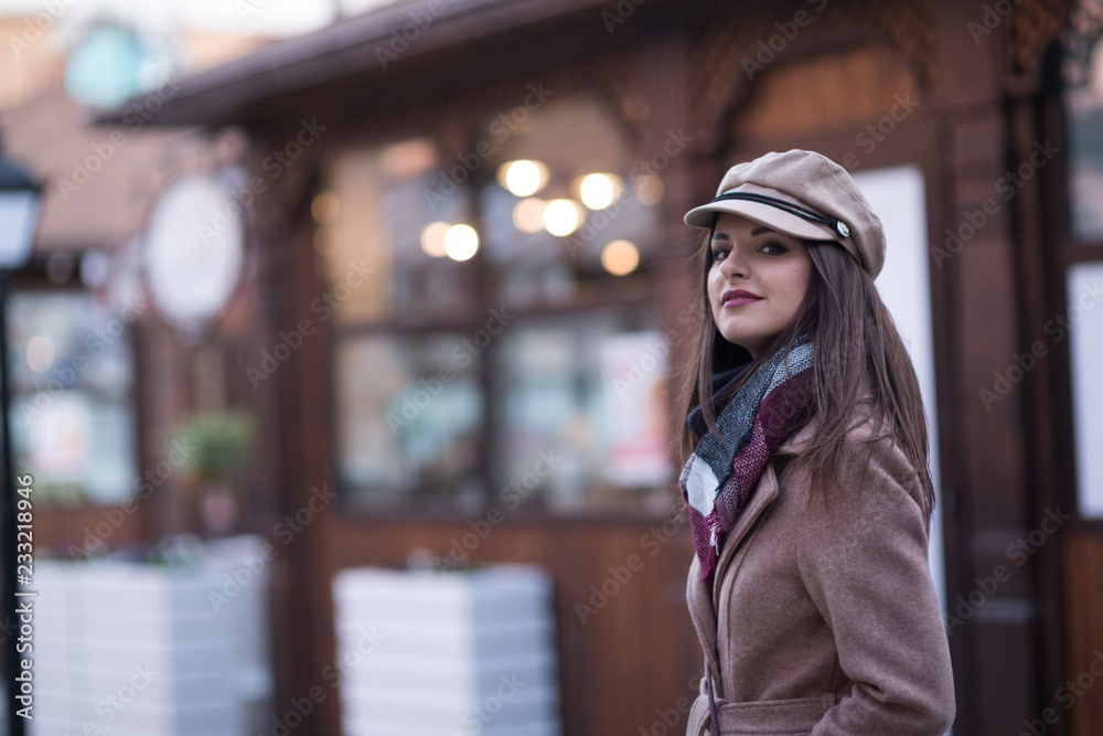 Obraz premium Young woman in a coat for a walk