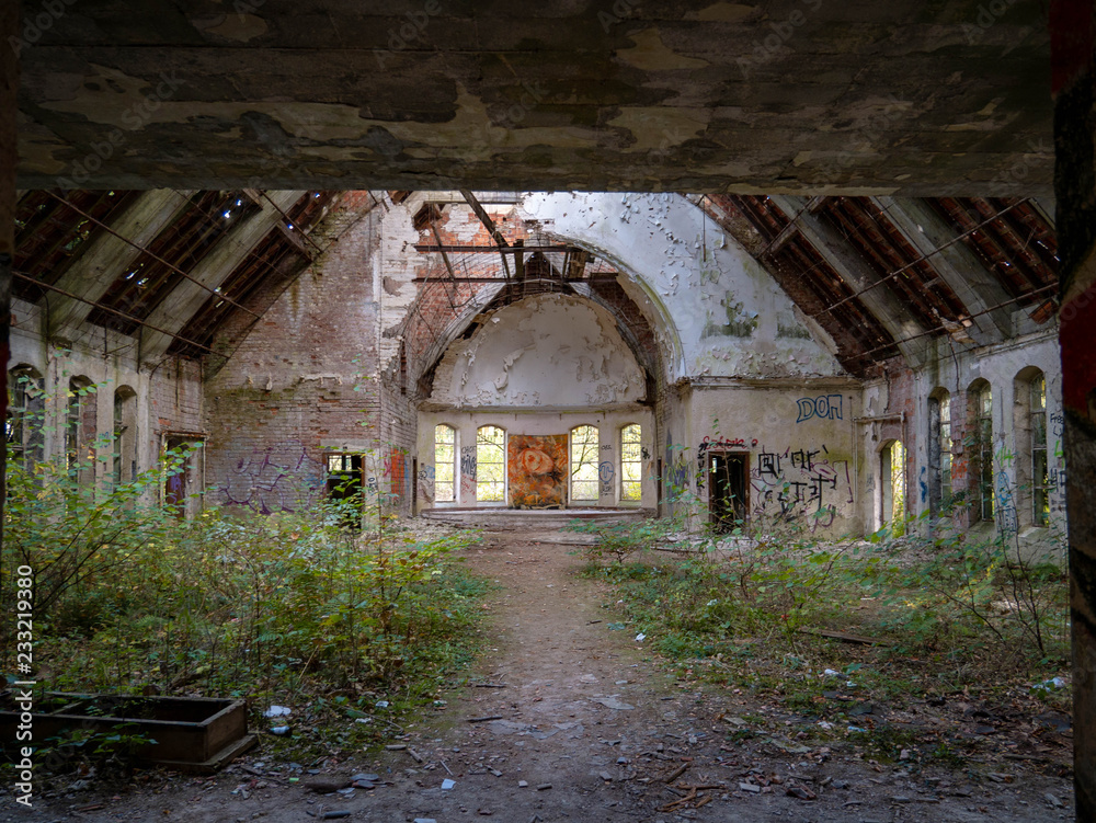 Fototapeta premium Abandoned church in old British military barracks in Werl, Germany, falling apart and vandalized