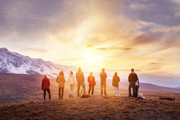 Group people sunset mountains view