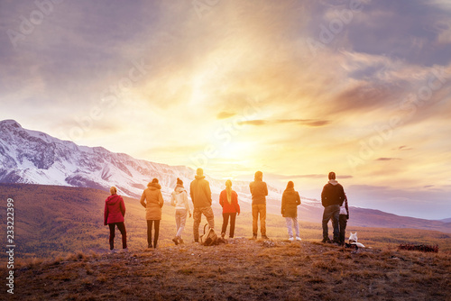 Group people sunset mountains view