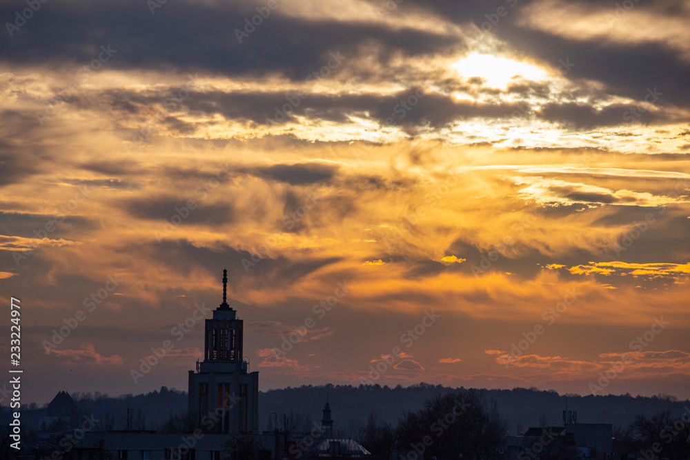 Skyline of church tower during sunset