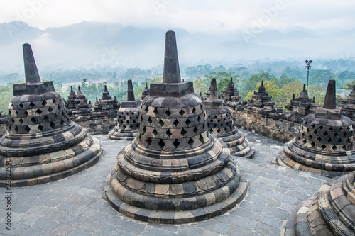 Sunrise among the stupas in Borobodur, a 9th-century Mahayana Buddhist complex in Magelang, Central Java, Indonesia