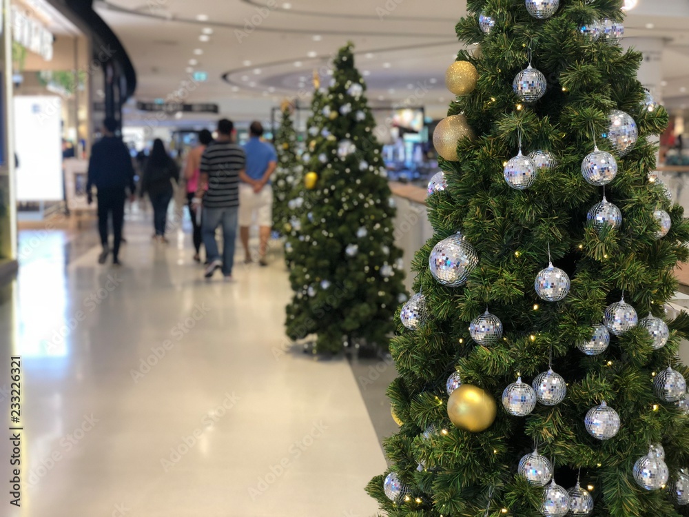 Nonthaburi, Thailand - November 11, 2018 : Beautiful Xmas tree decorated with silver and gold sparkling ball in the department store for celebrate christmas holiday Nonthaburi, Thailand - November 11, 2018 : Beautiful Xmas tree decorated with silver and gold sparkling ball in the department store for celebrate christmas holiday