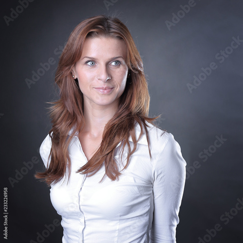 confident young business woman.isolated on dark background