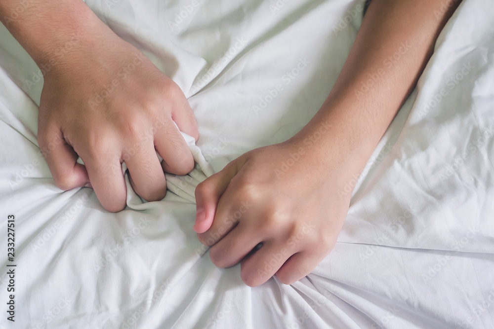 Hands of couple lover sex on the bed,Concept about love, sex and lifestyle. Hands of couple lover sex on the bed,Concept about love, sex and lifestyle.